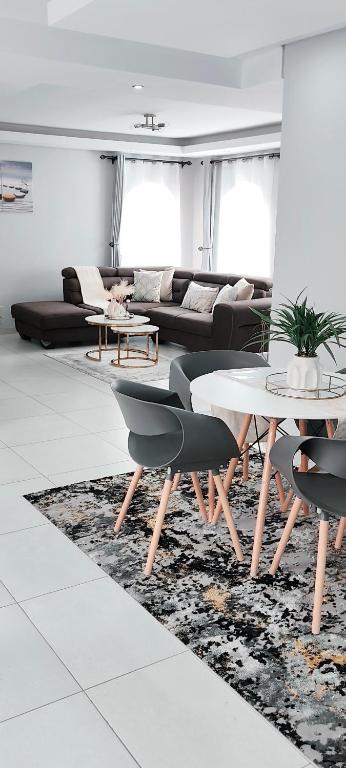 a living room with a table and a couch at The Haven in Nelspruit