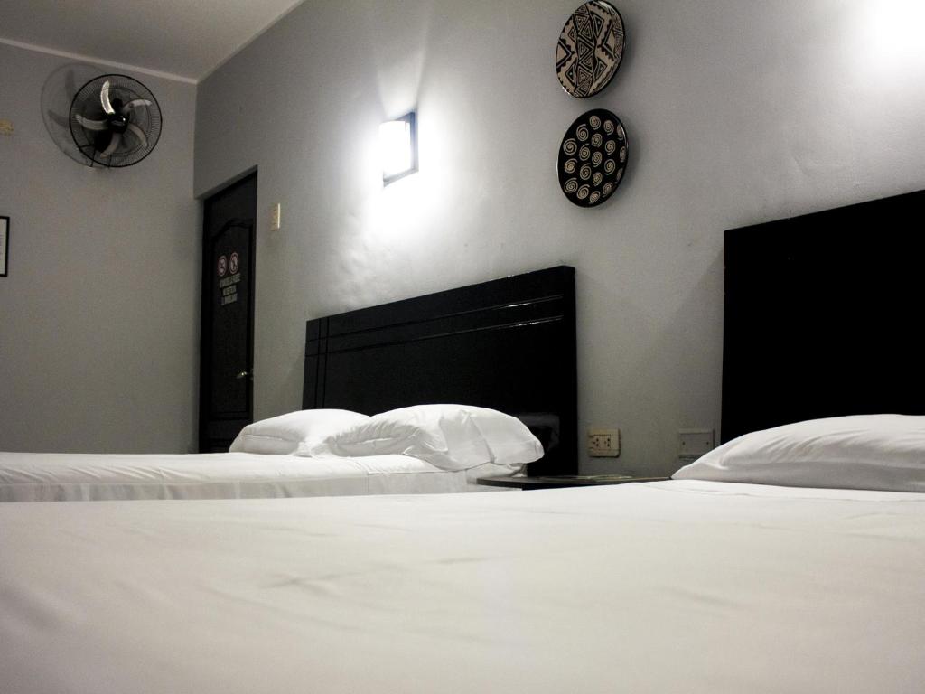 Postel nebo postele na pokoji v ubytování Jer`s Hostal