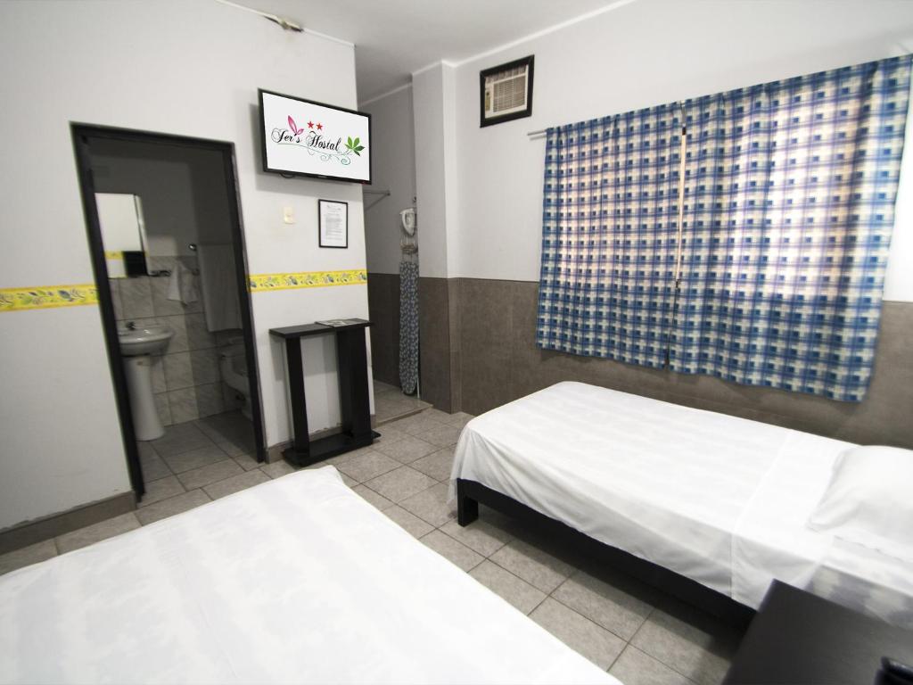 Postel nebo postele na pokoji v ubytování Jer`s Hostal
