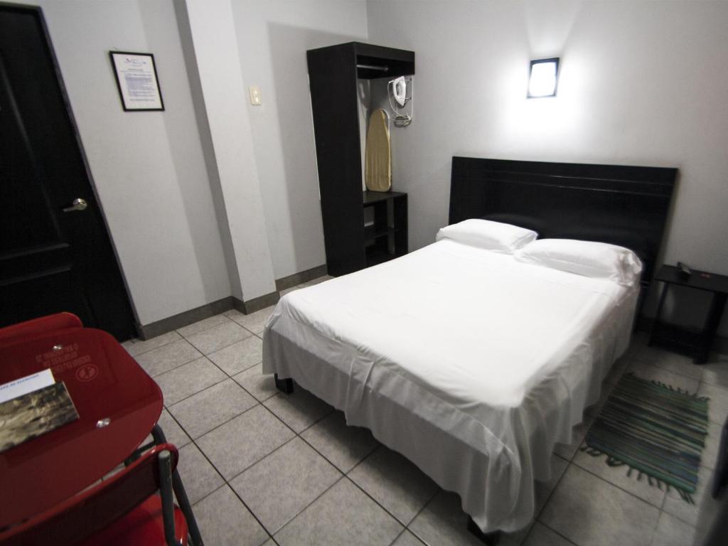 Postel nebo postele na pokoji v ubytování Jer`s Hostal