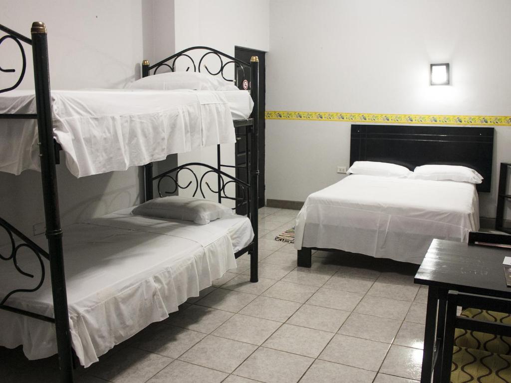 Postel nebo postele na pokoji v ubytování Jer`s Hostal