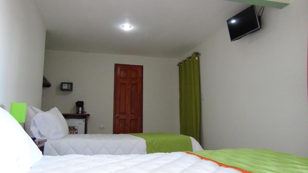 Postel nebo postele na pokoji v ubytování Mountain Faro Hotel