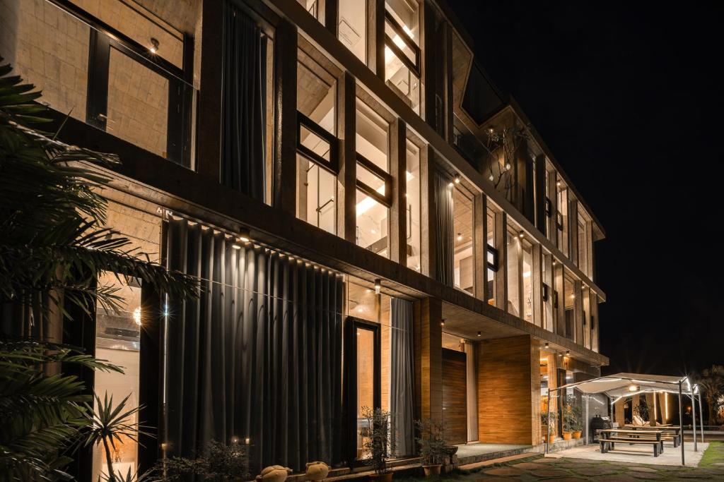 a building with a lot of windows at night at 135 會館 135 Private Villa Yilan in Dongshan