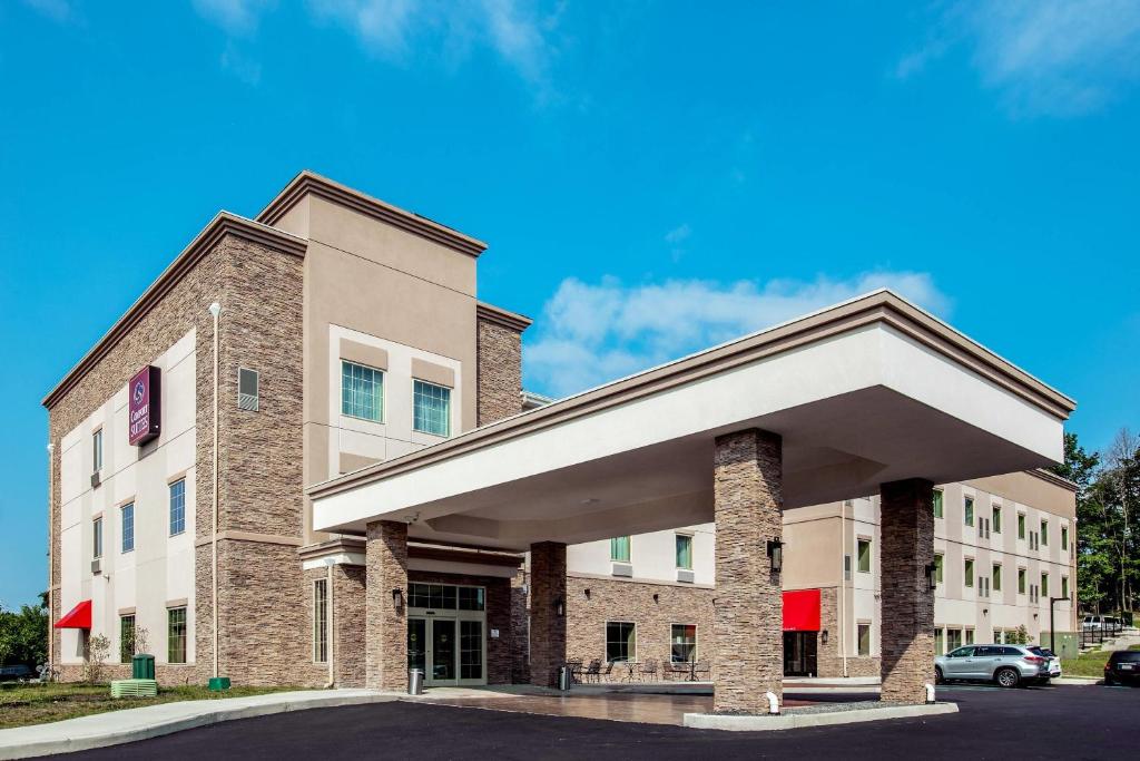 a large brick building with a parking lot at Comfort Suites Fishkill near Interstate 84 in Fishkill
