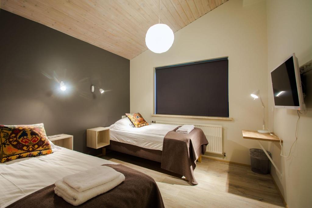 Voodi või voodid majutusasutuse Brekkugerdi Guesthouse toas