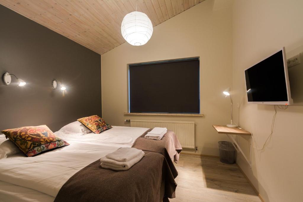 Voodi või voodid majutusasutuse Brekkugerdi Guesthouse toas