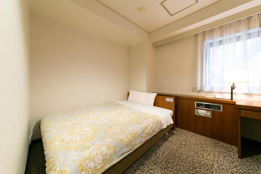 Postel nebo postele na pokoji v ubytování Hotel Ohedo