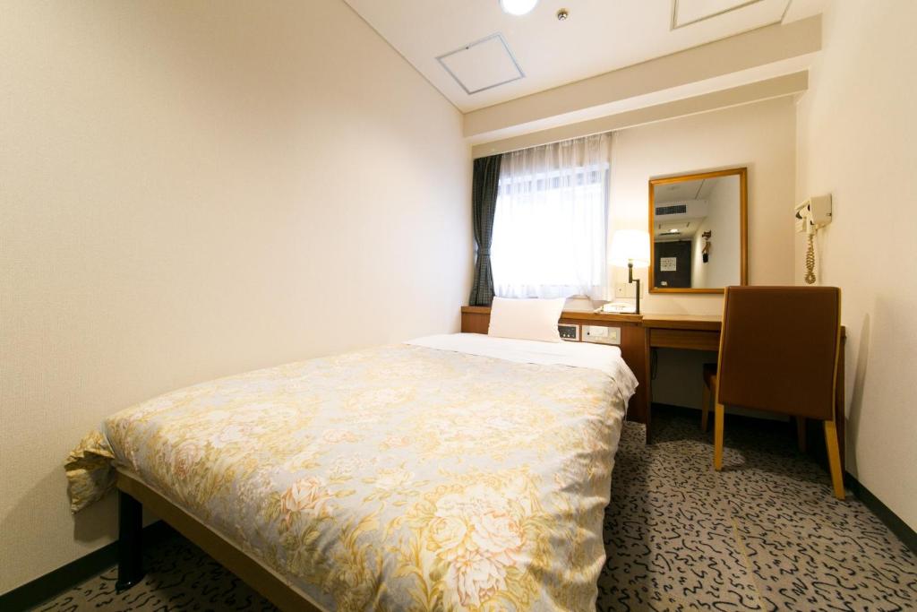 Postel nebo postele na pokoji v ubytování Hotel Ohedo