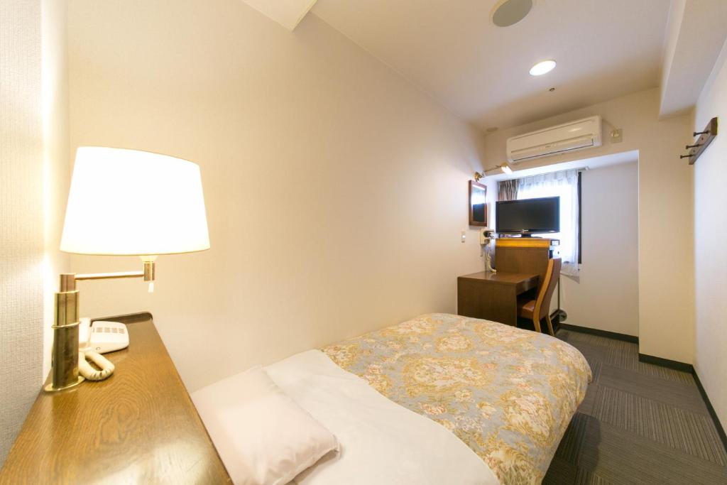 Postel nebo postele na pokoji v ubytování Hotel Ohedo