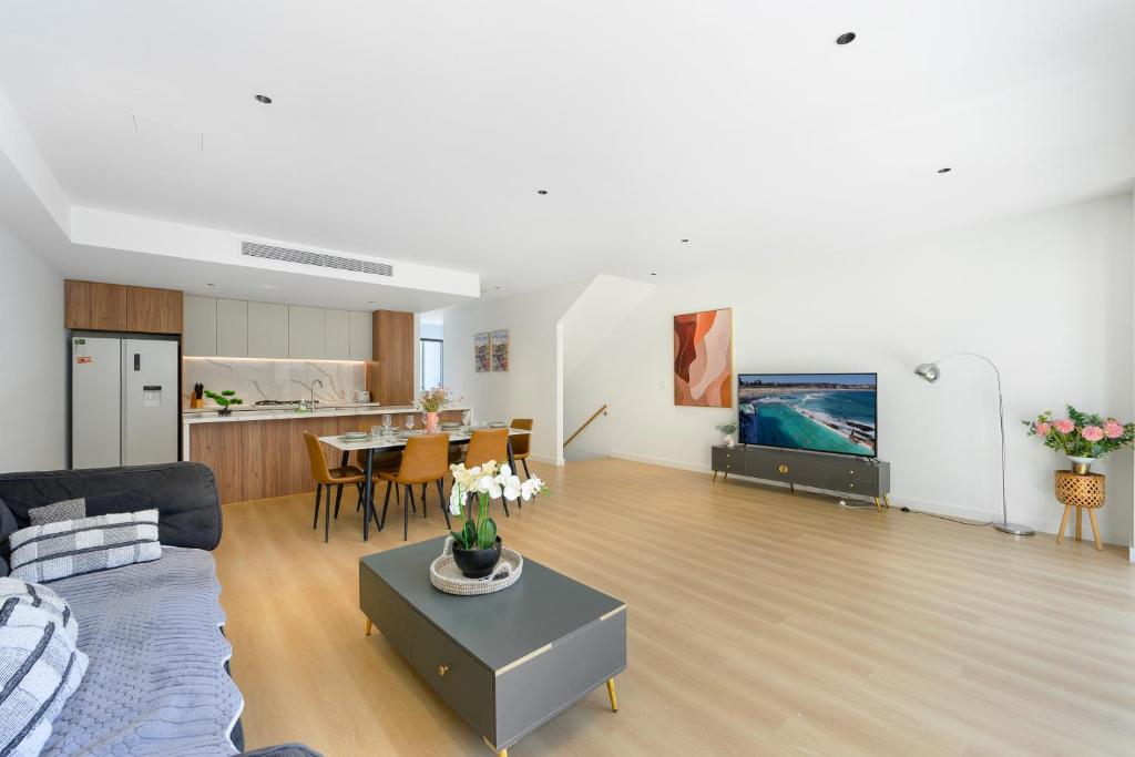 a living room with a couch and a table at 4BR Spacious Townhouse in Box Hill in Annangrove