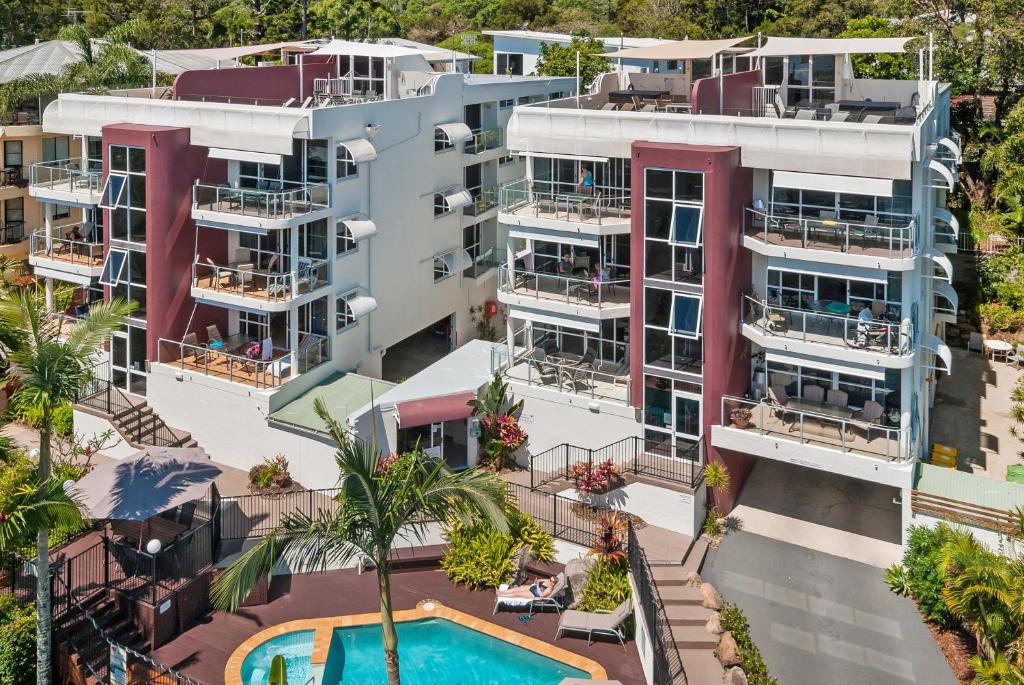 an aerial view of an apartment complex with a swimming pool at Bali Hai Apartments Noosa in Noosa Heads