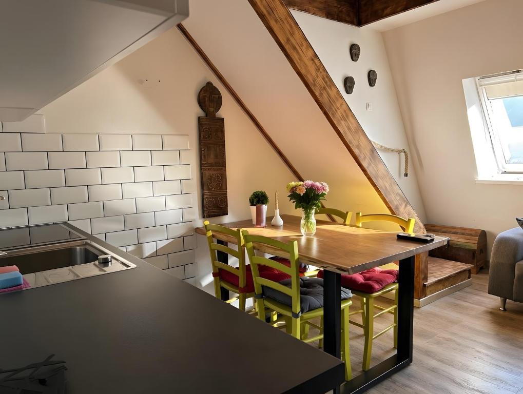 a kitchen with a table and chairs in a room at Apartment Luna in Bovec
