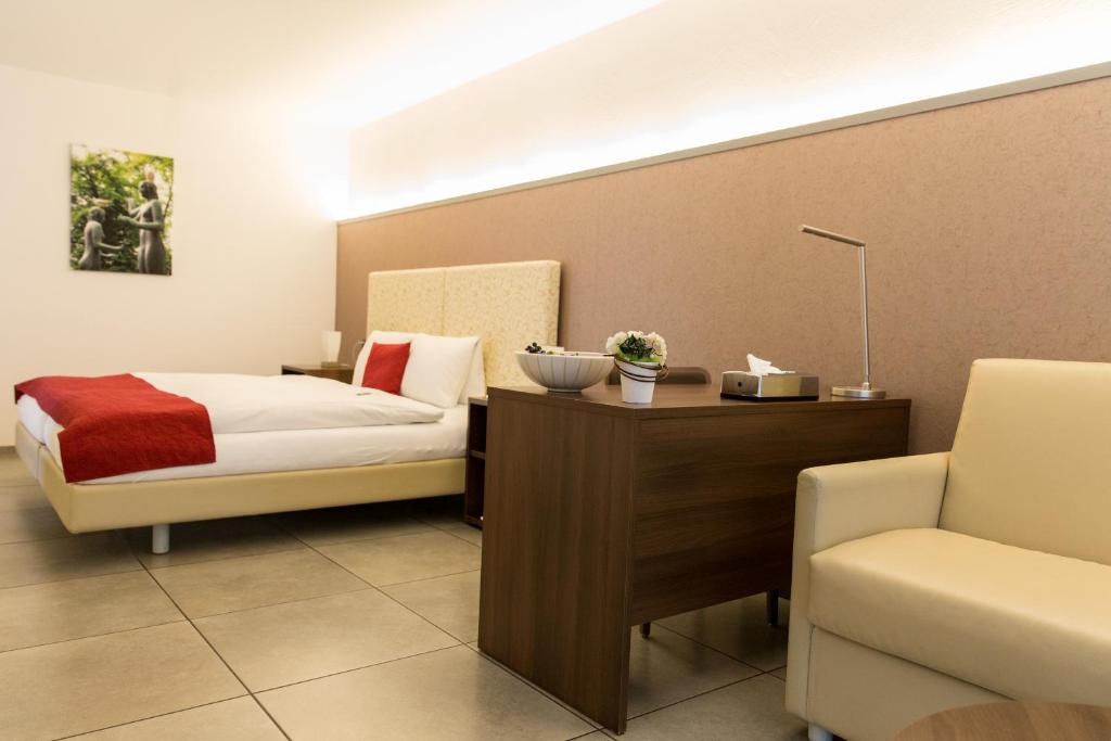 Postel nebo postele na pokoji v ubytování Hotel Schäfli Siebnen