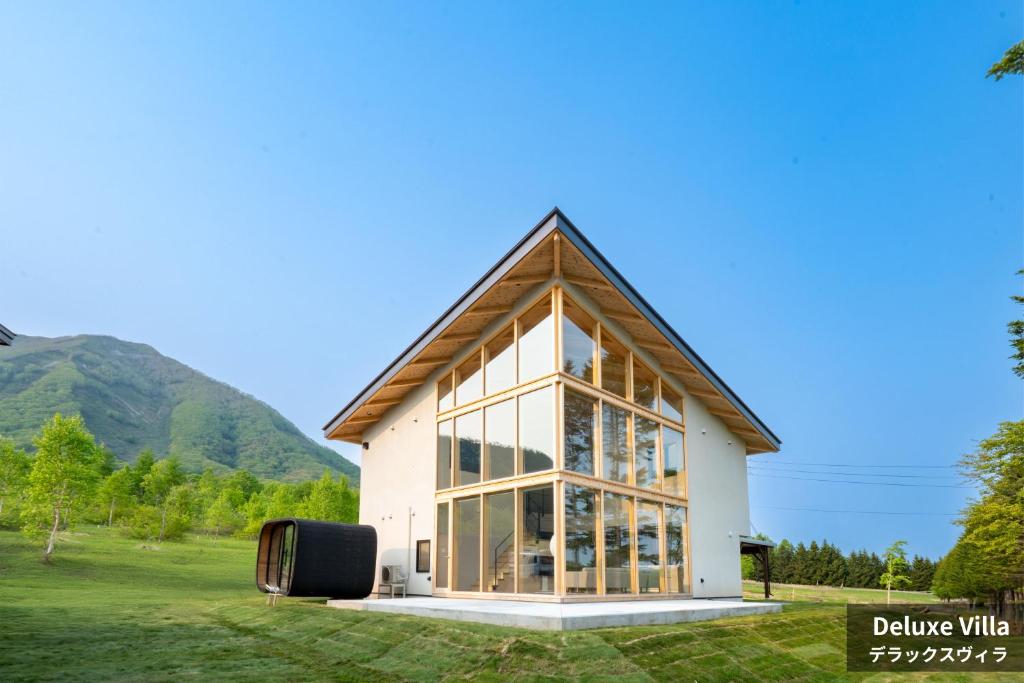 a house with a large group of windows at Rusutsu Hills CENTRO in Rusutsu