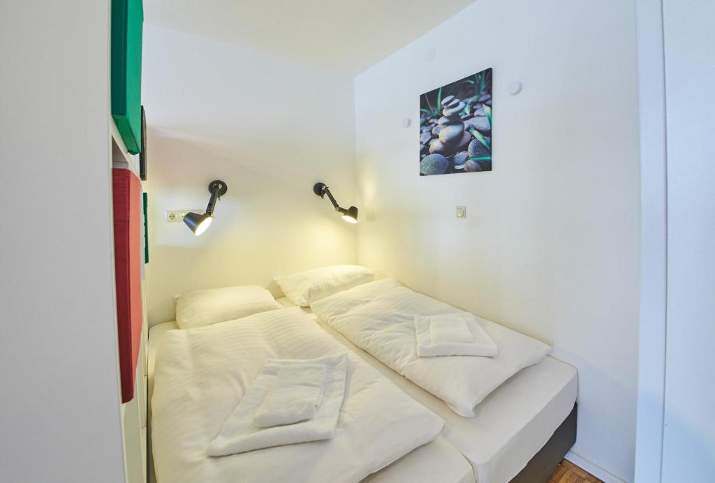 Posteľ alebo postele v izbe v ubytovaní Appartement Relax & Sport