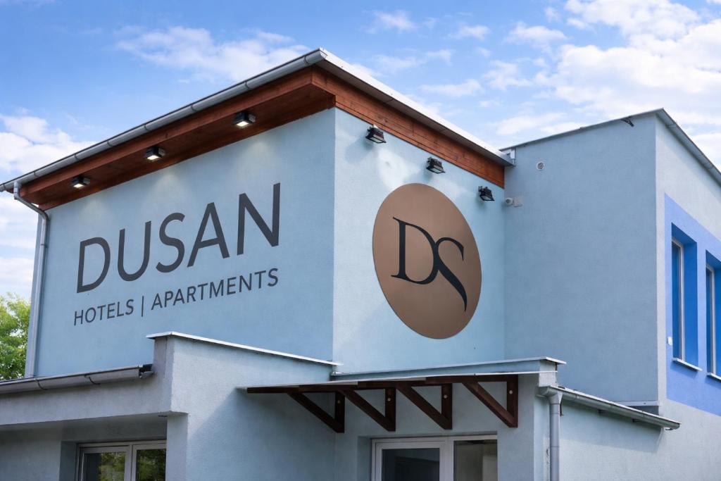 a sign on the side of a building at Dusan Apartments in Orlová