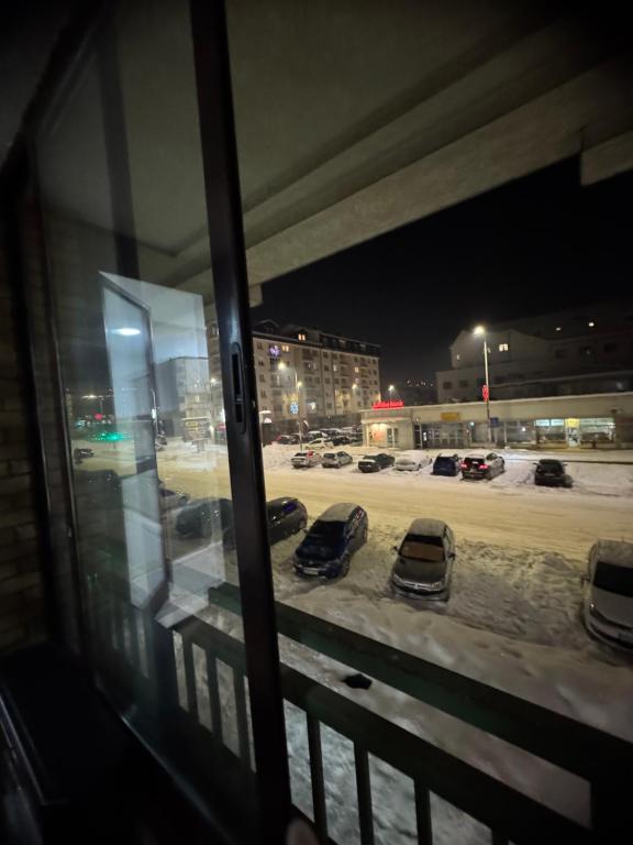 a group of cars parked in a parking lot at night at SS Stan in Pale