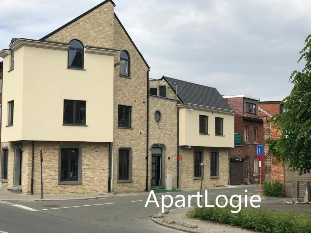 an apartment building on the corner of a street at Apartlogie in Tongeren