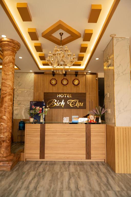 a hotel bar with a chandelier in a lobby at Bich Thu Hotel in Ho Chi Minh City