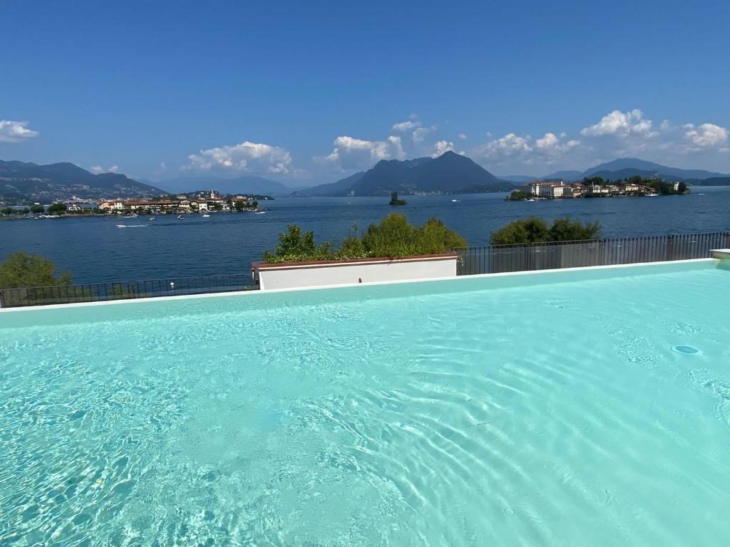 a large swimming pool with a view of the water at MyLago in Baveno