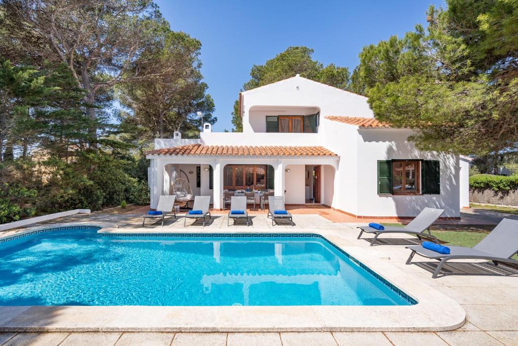 a villa with a swimming pool and a house at Villa Misuco by 3VILLAS in Son Parc