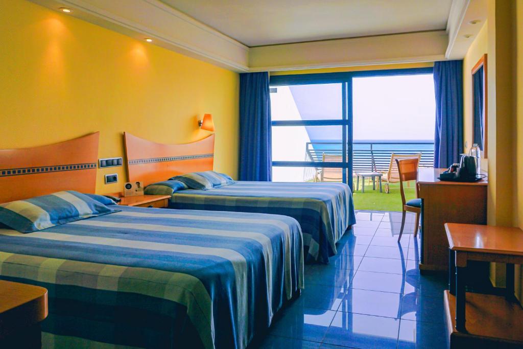 Krevet ili kreveti u jedinici u okviru objekta SBH Crystal Beach Hotel & Suites - Adults Only