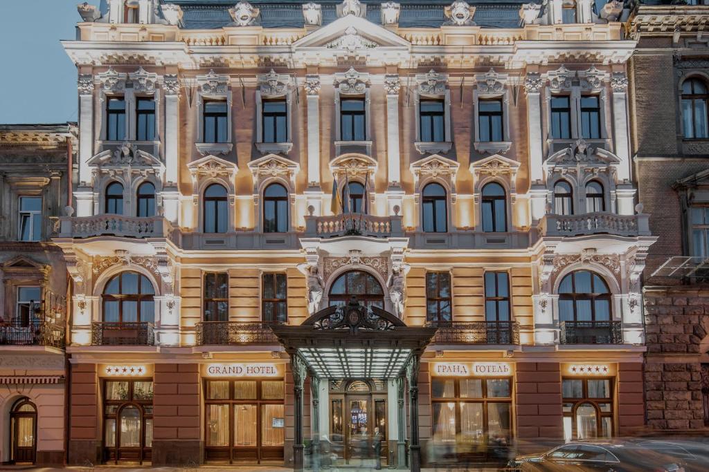 a large building in front of a street at Grand Hotel Lviv Casino & Spa in Lviv