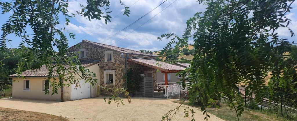 a house with a driveway in front of it at Gîte Le 1935 Évasion en Ardèche, au cœur de la campagne, idéal pour balades à vélo et moto in Saint-Sylvestre