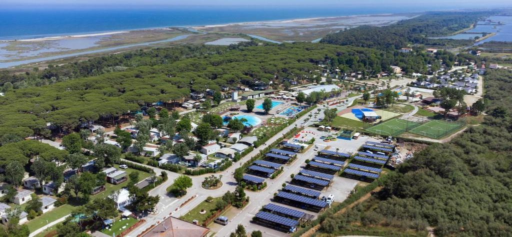an aerial view of a park next to the water at Glamping Lido di Spina in Lido di Spina