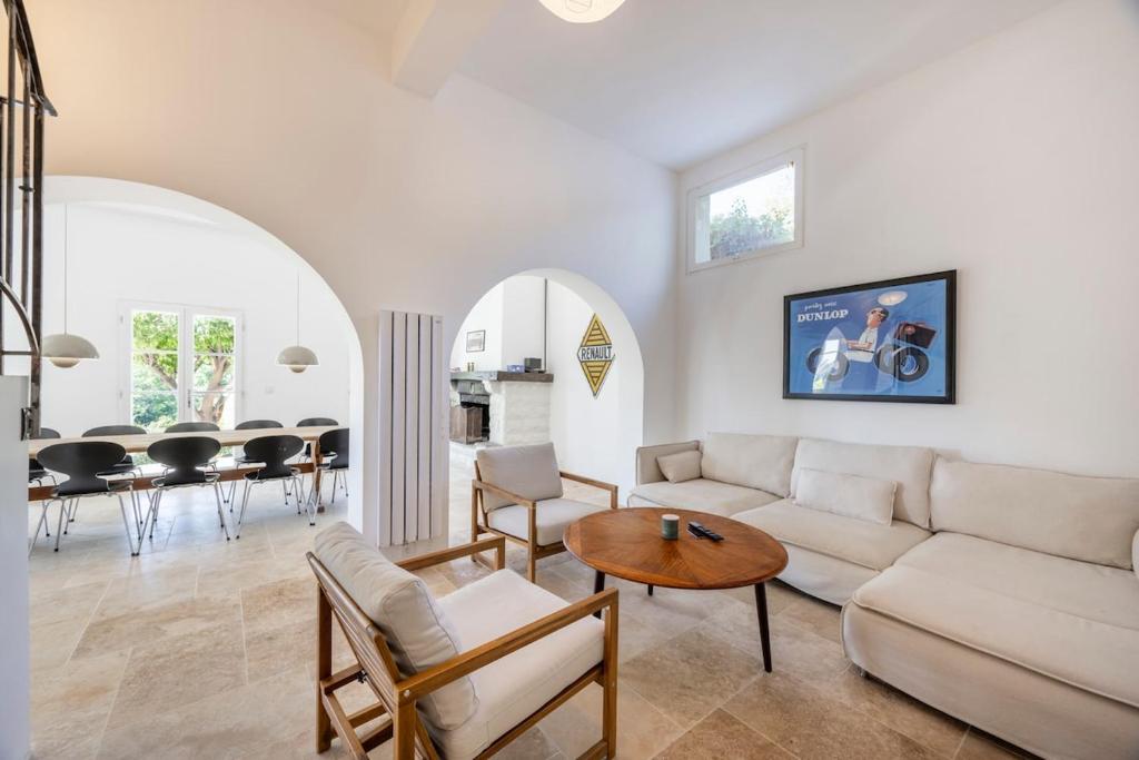 a living room with a couch and a table at House on the Hill in Nice