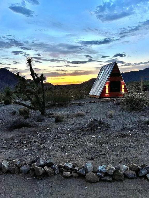 a small house in the middle of a field at Star Gazer #3 Glamping in Meadview