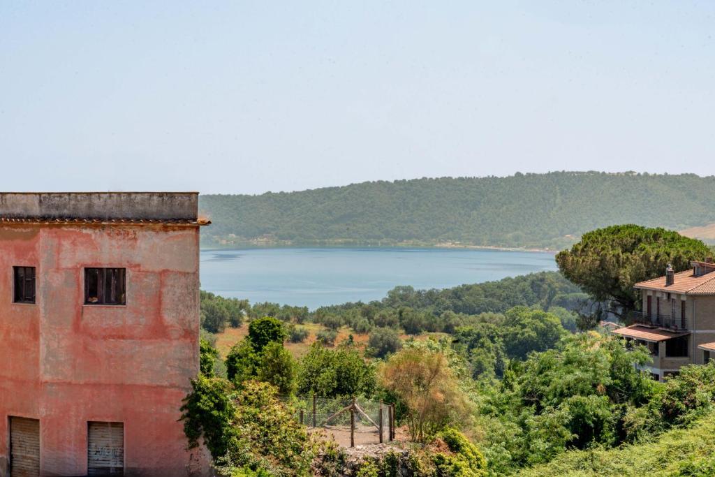 an old building with a view of a lake at Aura Apartment - VISTA LAGO - CENTRO STORICO in Bracciano