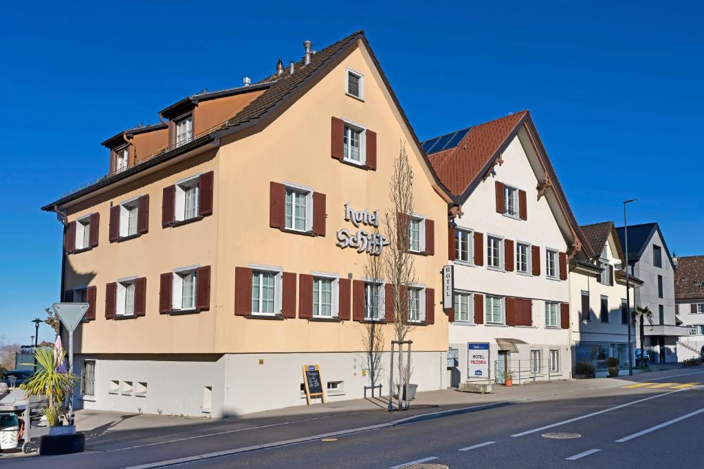 a large building on the side of a street at Hotel Schiff in Horn