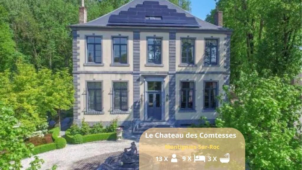 a house with a sign in front of it at Le Château des Comtesses - Vue lac, 13 pers in Montignies-sur-Roc