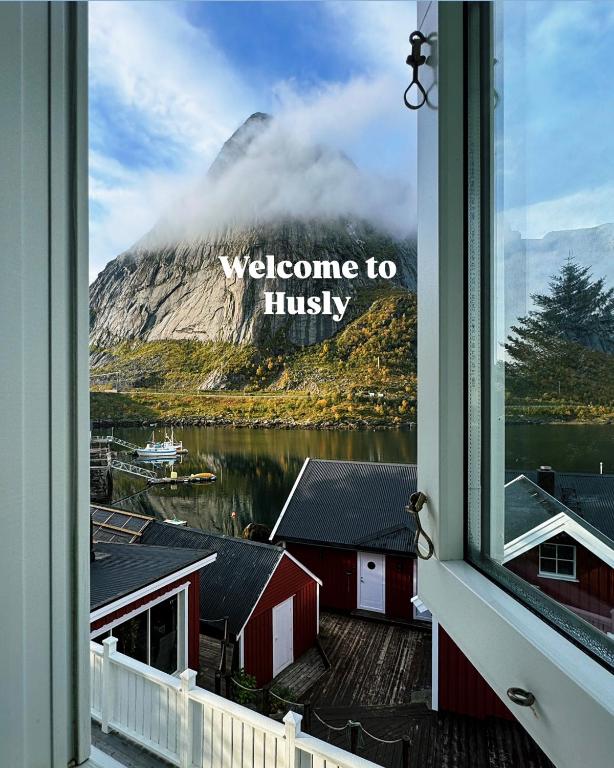 a window with a view of a mountain at Husly Reine - your home with Reinebringen view in Reine
