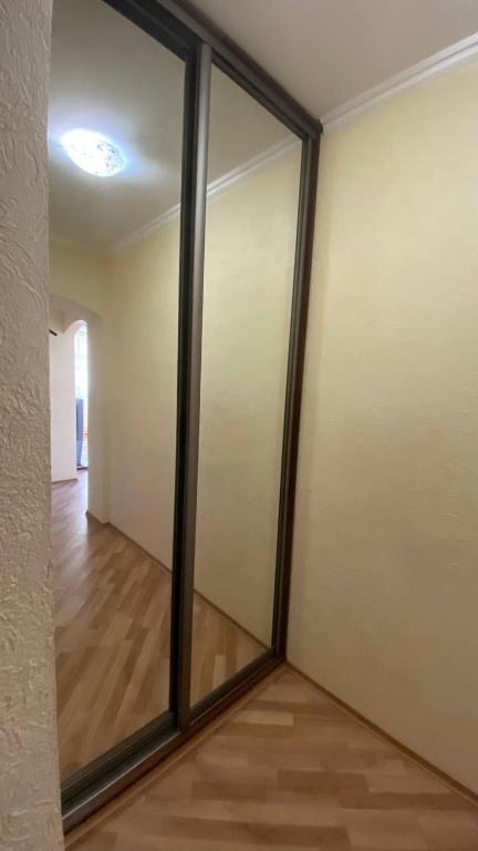 a room with sliding glass doors on a wall at Bright House in Bila Tserkva