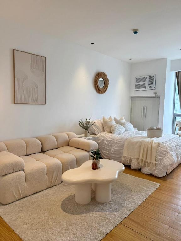 a living room with a couch and a coffee table at Heaven staycation in Angeles