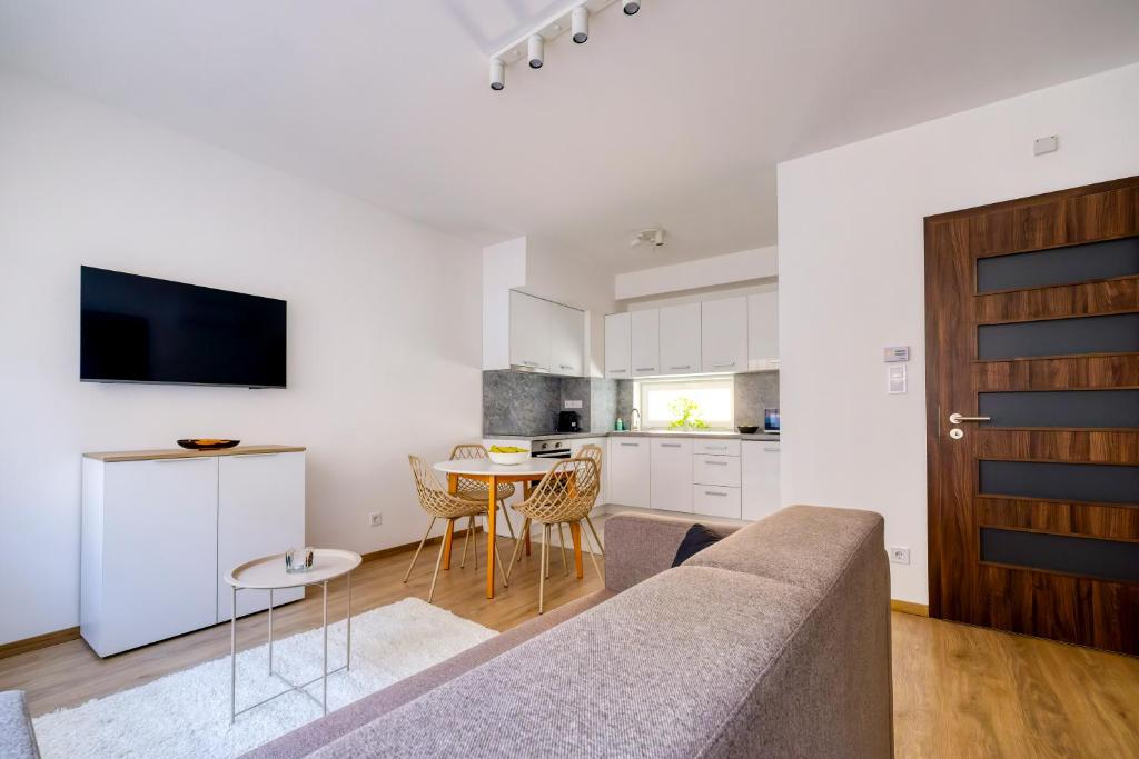 a living room with a couch and a table at Villa Oliver 2 Budapest in Budapest