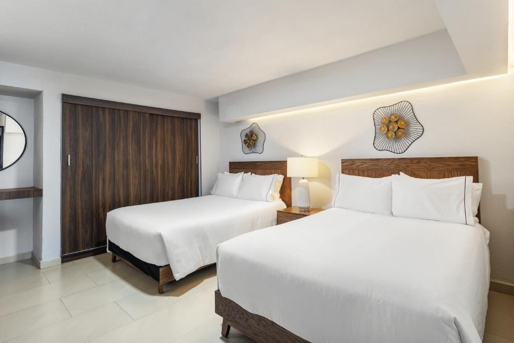 Cama o camas de una habitación en Sunvivia by Fiesta Americana Mazatlán
