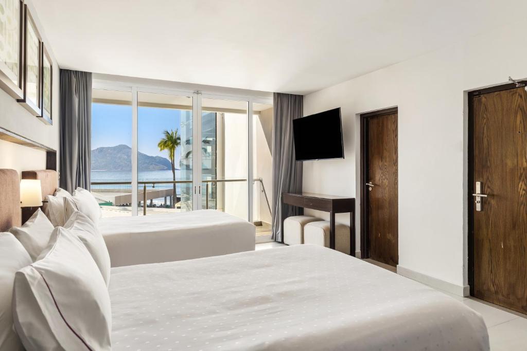 Cama o camas de una habitación en Sunvivia by Fiesta Americana Mazatlán