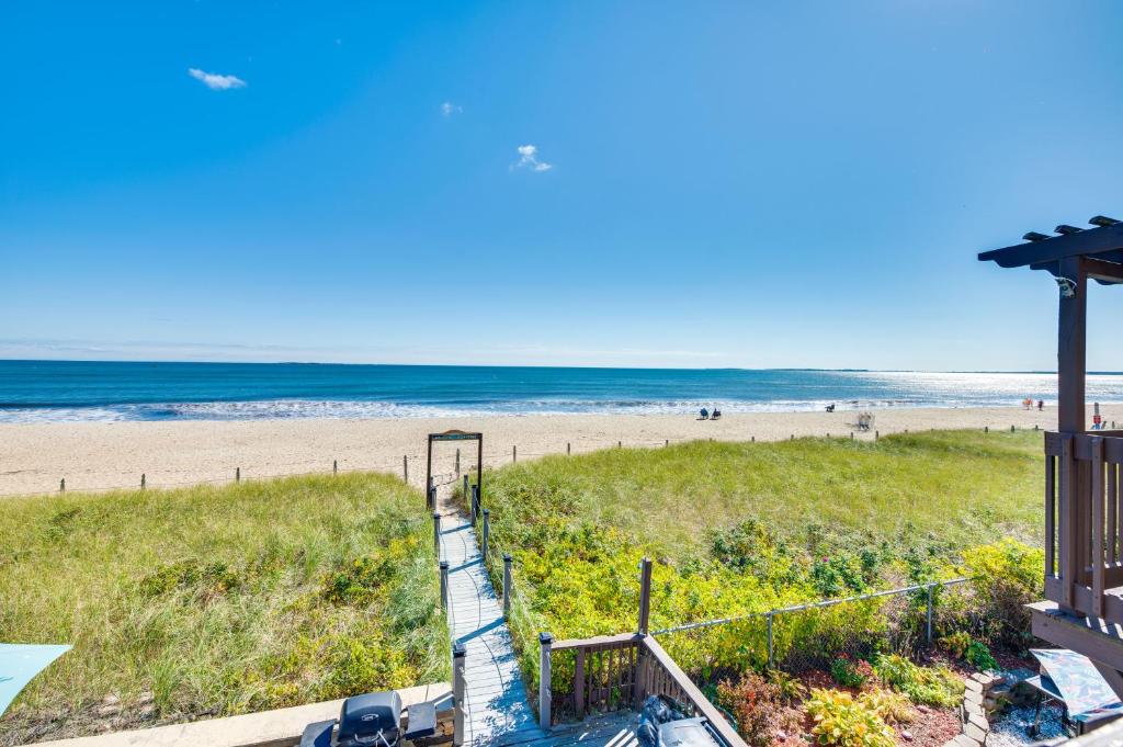a view of the beach from the balcony of a beach house at Steps to Sandy Beach! Oceanfront Old Orchard Gem in Old Orchard Beach