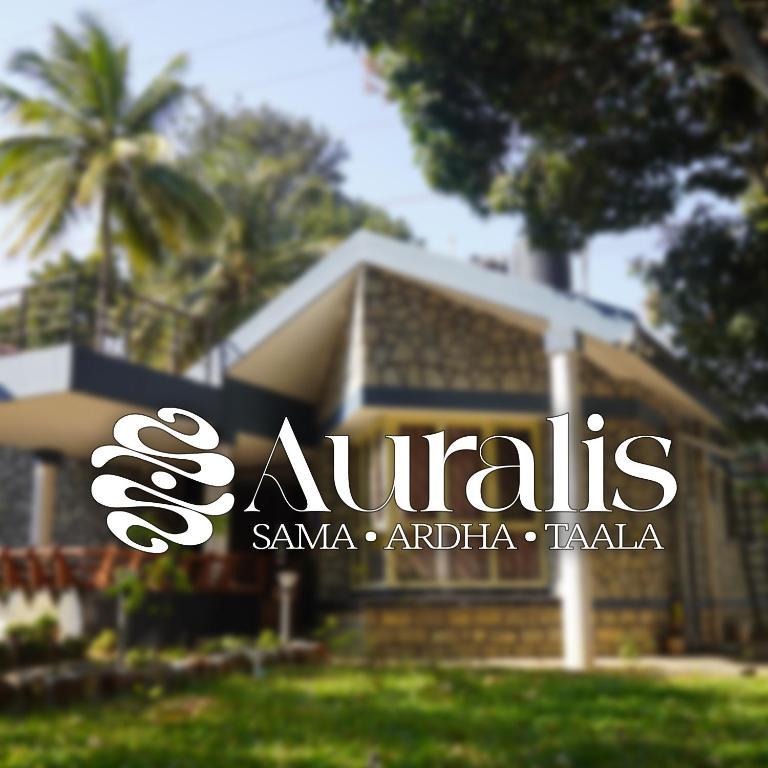 a house with a sign in front of it at Auralis Experience in Jigani