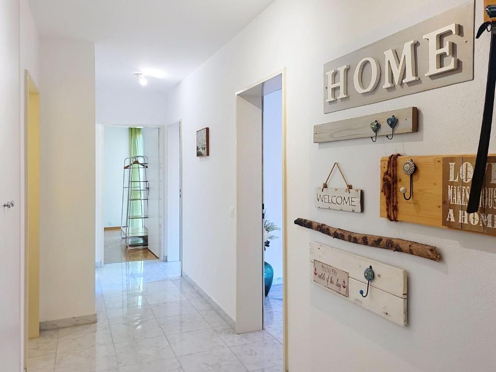 a hallway with a house sign on the wall at Apartment Apt- Hermosa by Interhome in Locarno