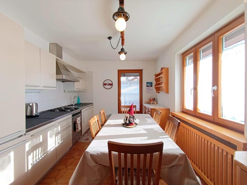 a kitchen with a table and chairs in a room at Apartment Casa Dalpi by Interhome in Predazzo