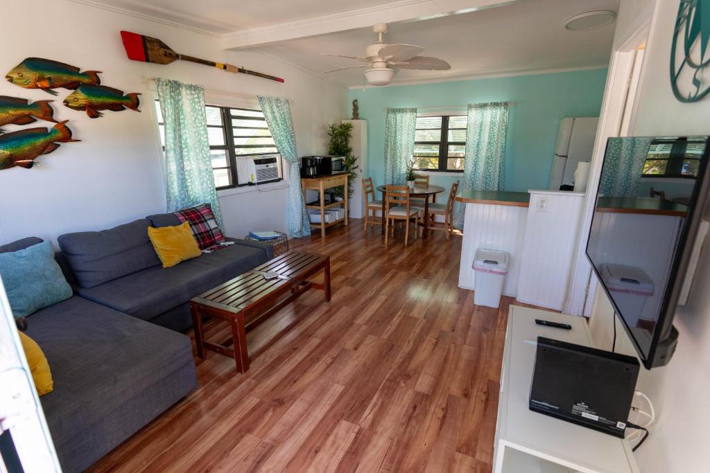 a living room with a couch and a table at Cindy Villa in Key Largo