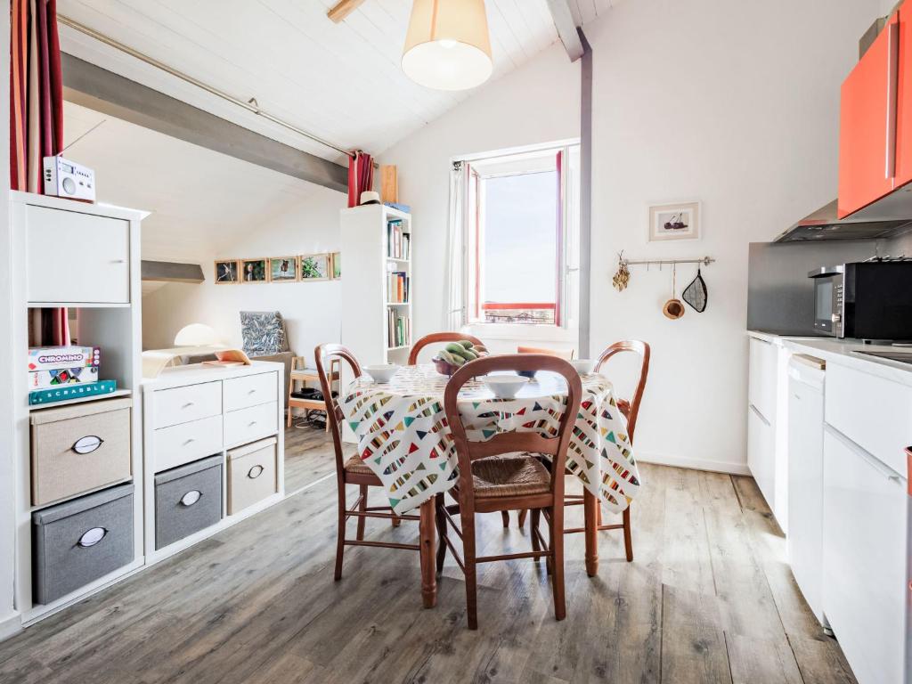 a kitchen with a table and chairs in a room at Apartment Barasteguia by Interhome in Ciboure