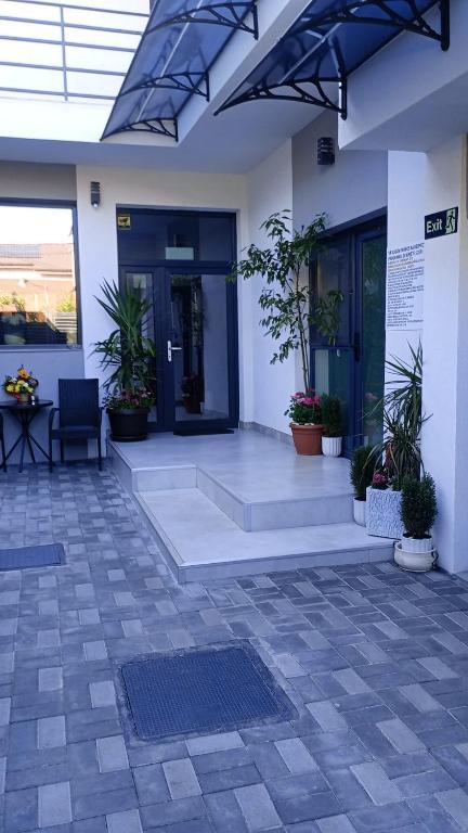an empty lobby with plants in a building at PARAVANHouse in Constanţa