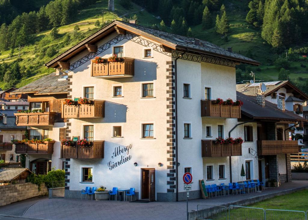 
a small town with a large building at Hotel Giardino in Bormio
