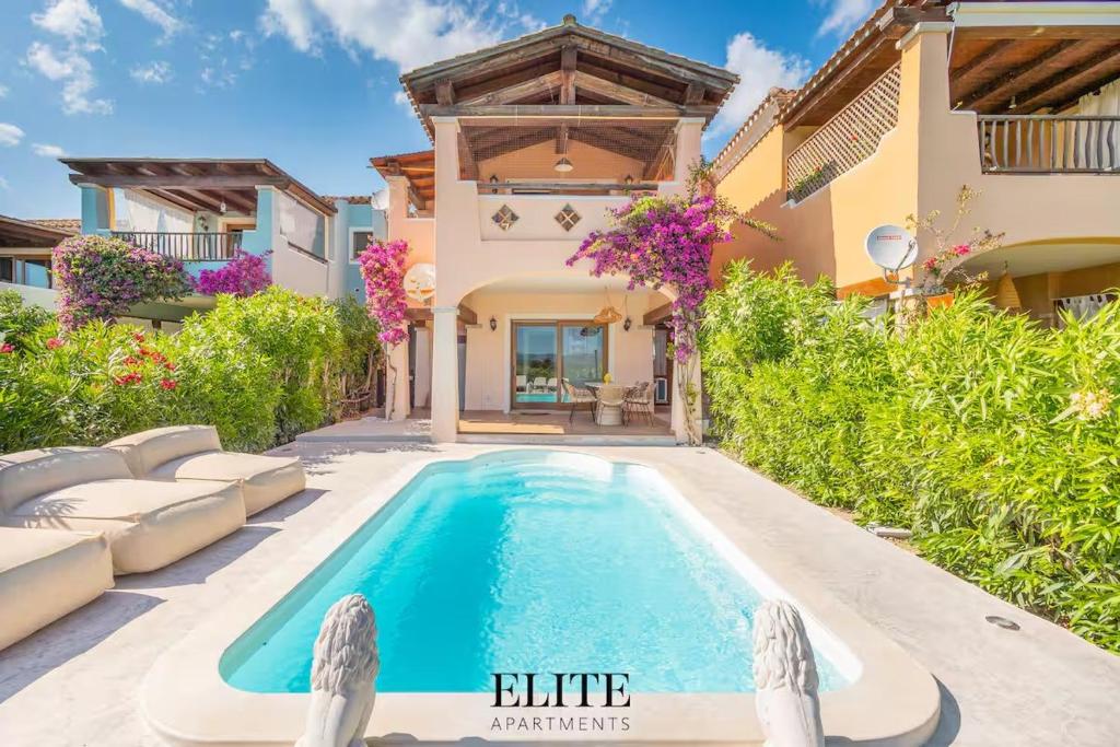 a swimming pool in the backyard of a house at Elite Collection Domo Mea Private Pool in Olbia