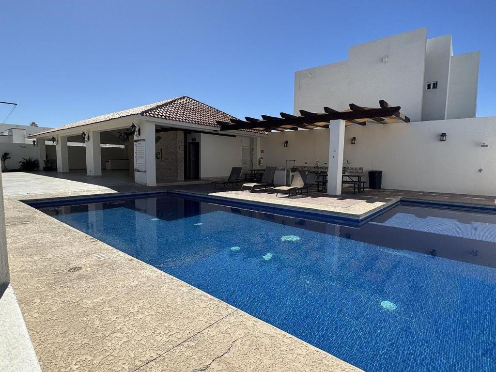 a swimming pool in front of a house at Casa Romina in La Paz